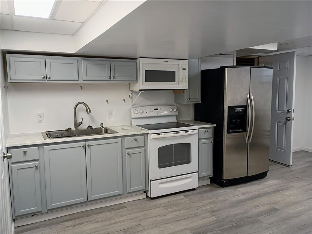 1115 Cascade Drive Homestead, PA 15120 - Photo 23 of 31 a kitchen with stainless steel appliances a refrigerator stove and sink