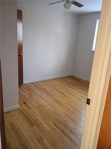 a white toilet sitting next to a bathroom sink
