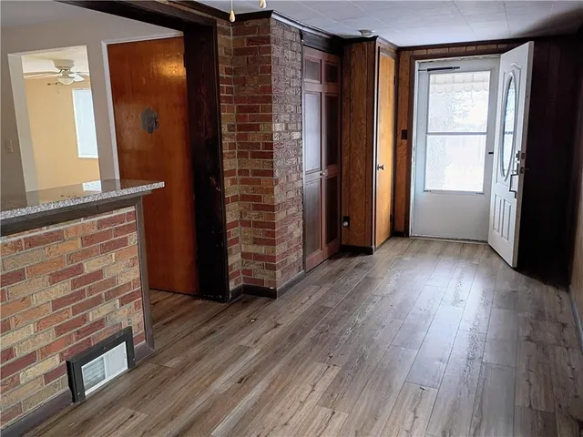 a view of front door with wooden floor