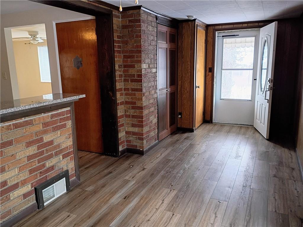 1115 Cascade Drive Homestead, PA 15120 - Photo 9 of 31 an empty room with wooden floor and windows