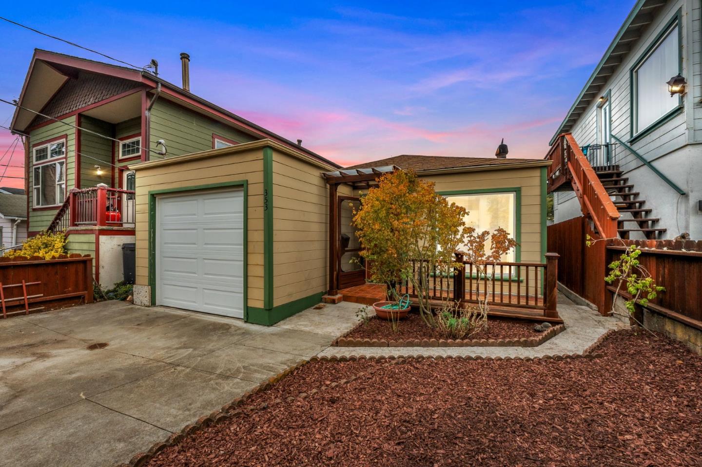 a view of a house with wooden fence