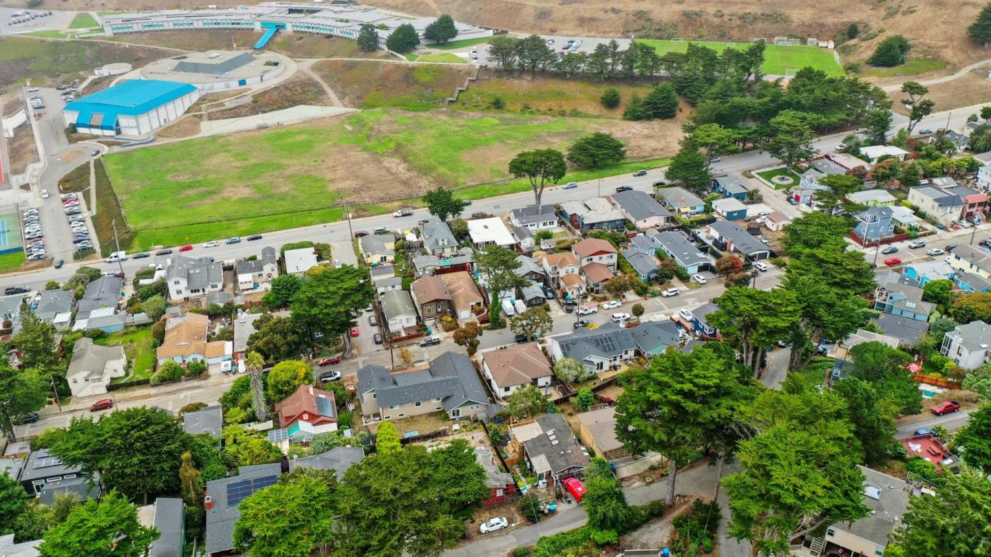 353 Carmel Avenue Pacifica, CA 94044 - Photo 7 of 8 an aerial view of residential houses with outdoor space and lake view