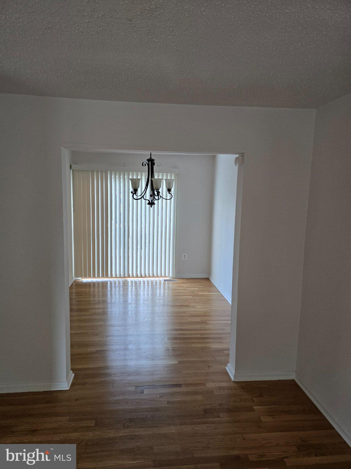 809 St Michaels Drive Bowie, MD 20721 - Photo 3 of 17 a view of a hallway with wooden floor