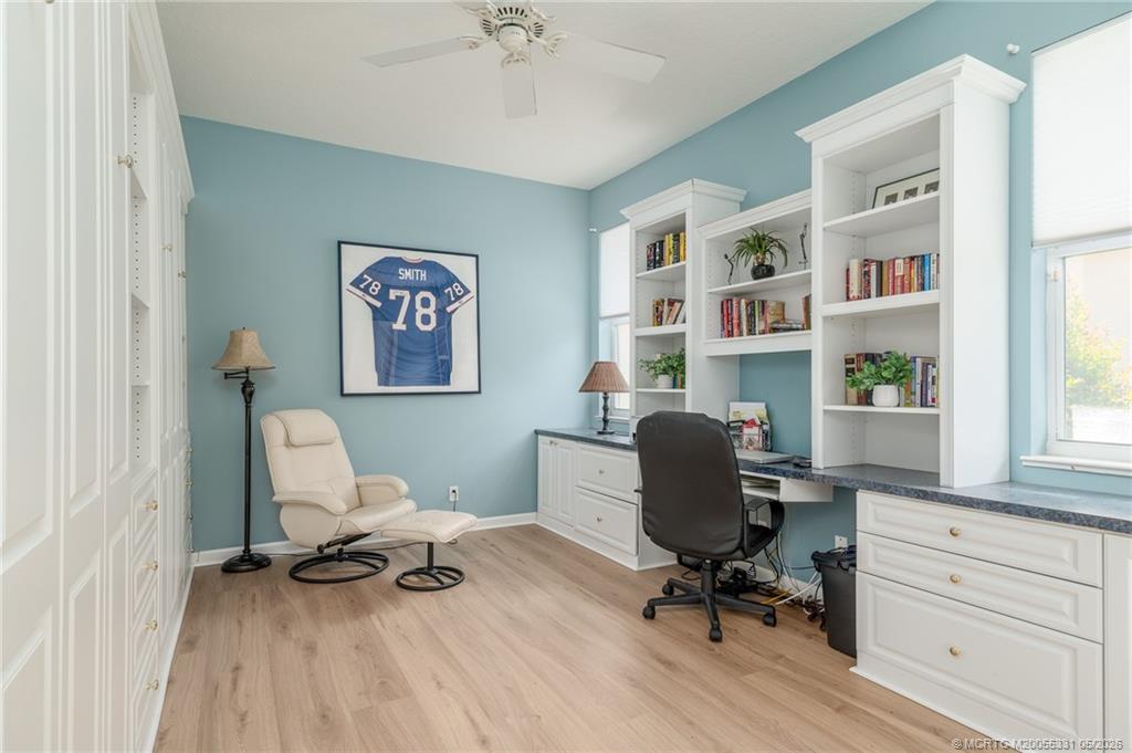 2216 Southeast Stonehaven Road Port St. Lucie, FL 34952 - Photo 23 of 67 a view of a workspace with furniture and a window