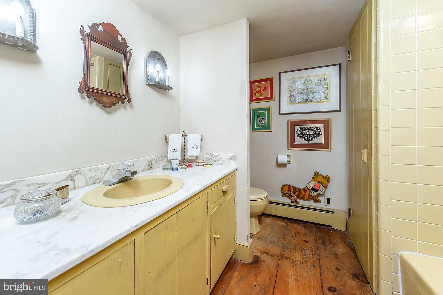 83 Hospital Road Greenwich, NJ 08323 - Photo 20 of 42 a bathroom with a granite countertop sink and a mirror