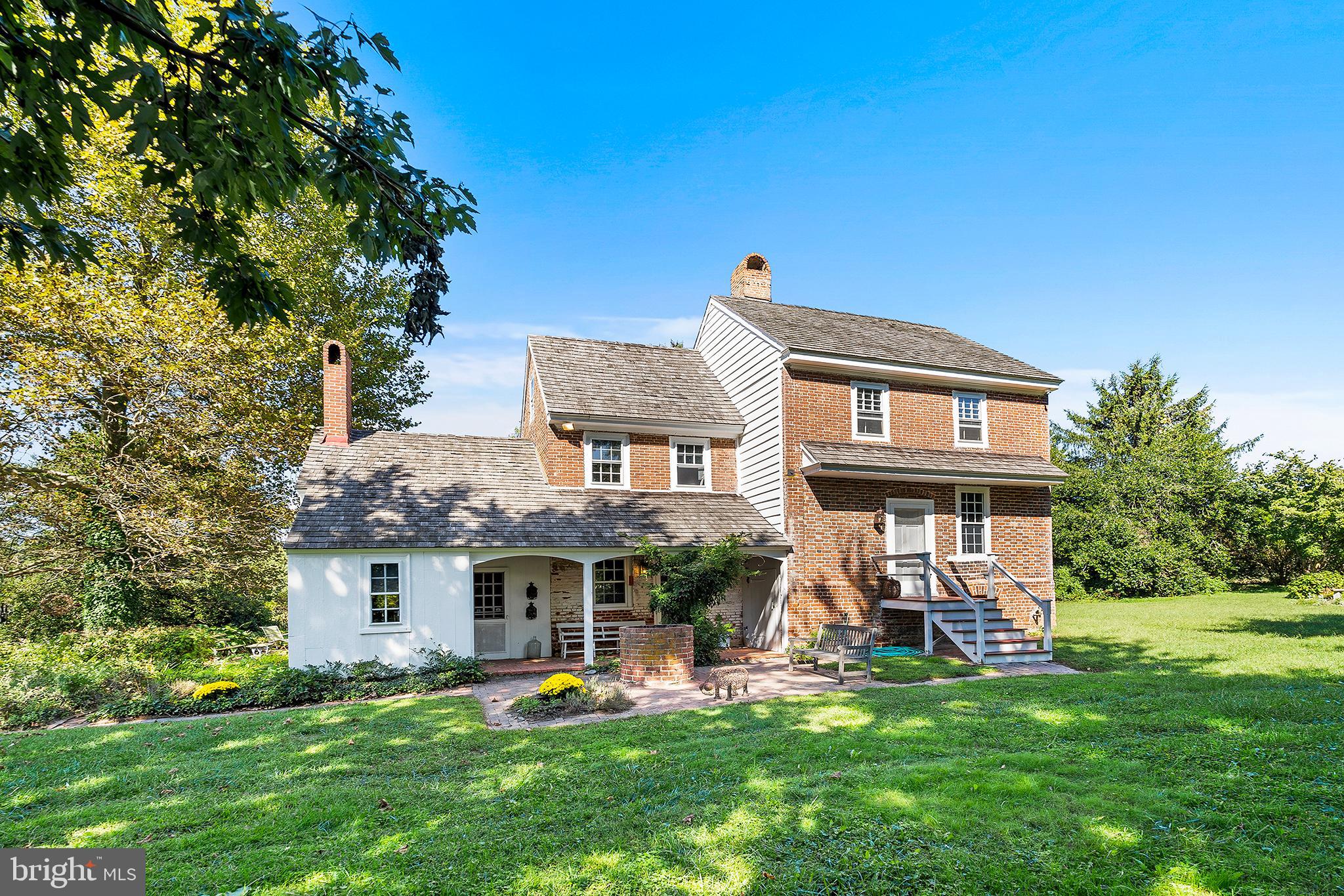 83 Hospital Road Greenwich, NJ 08323 - Photo 2 of 42 a front view of a house with a garden and trees