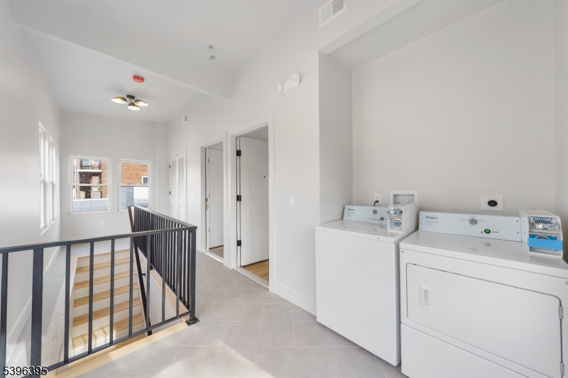 114 Center Street, Unit 2A Garwood, NJ 07027 - Photo 13 of 20 a view of a hallway with workspace