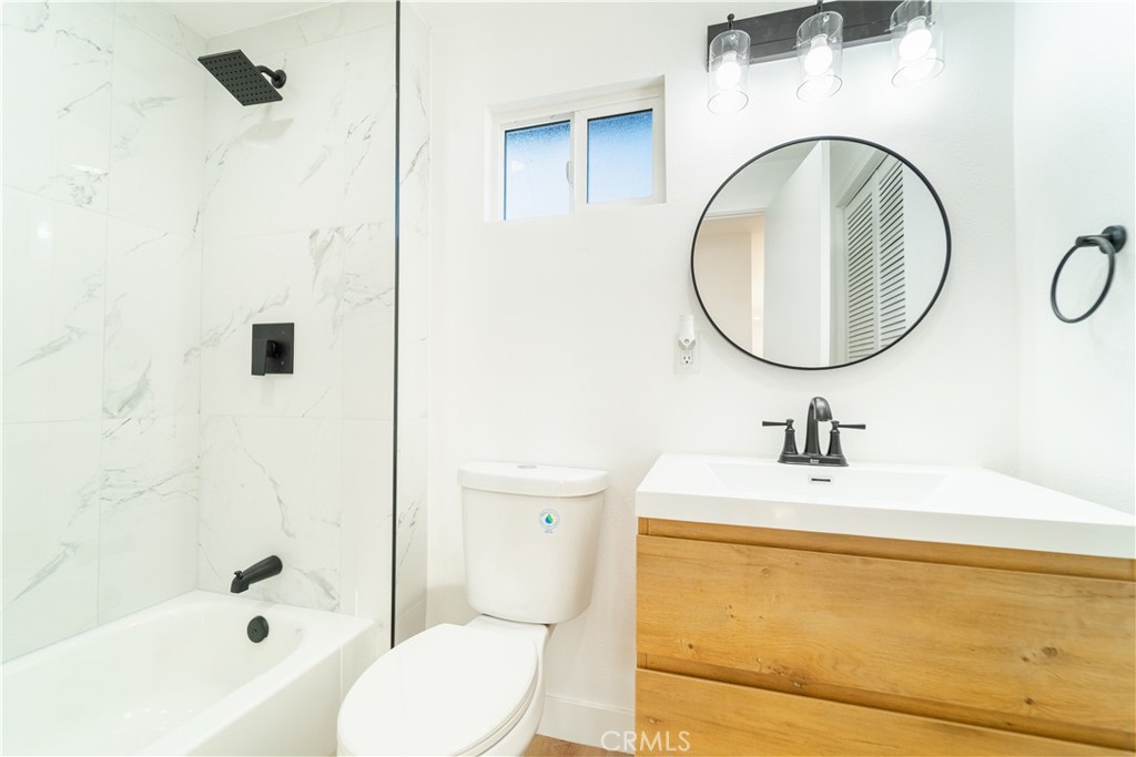 65125 Saturn Street Joshua Tree, CA 92252 - Photo 20 of 40 a bathroom with a sink a toilet and a mirror