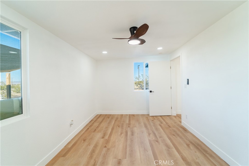 65125 Saturn Street Joshua Tree, CA 92252 - Photo 21 of 40 a view of empty room with wooden floor