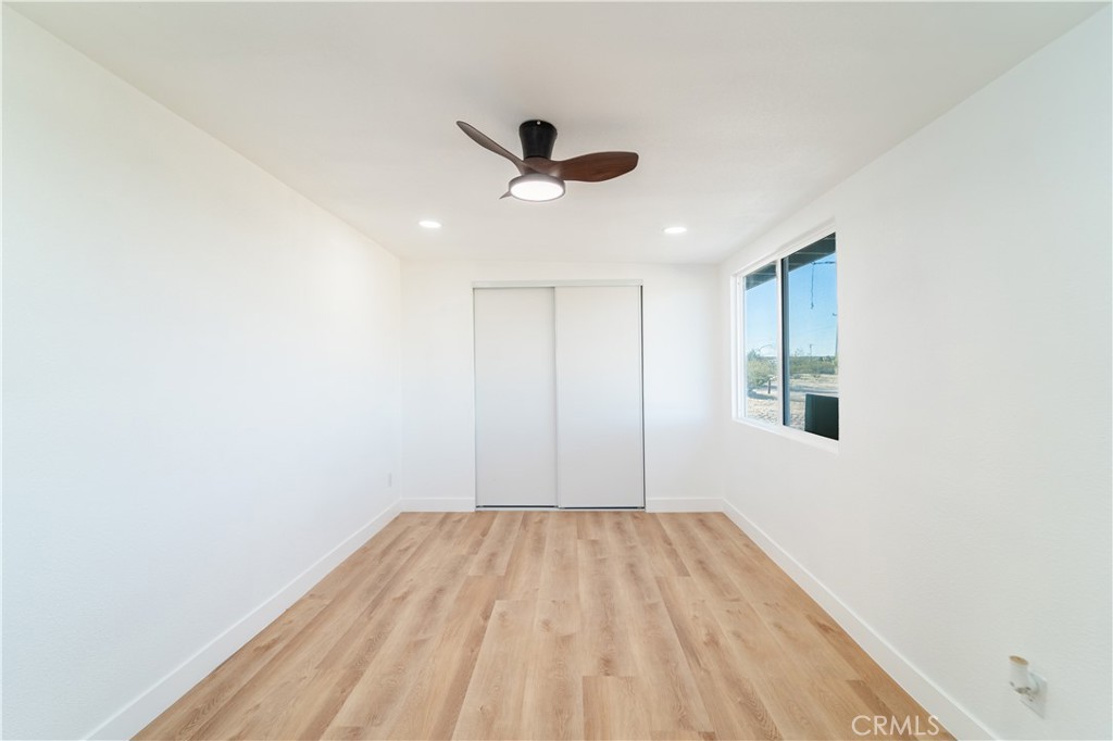 65125 Saturn Street Joshua Tree, CA 92252 - Photo 22 of 40 a view of empty room with wooden floor
