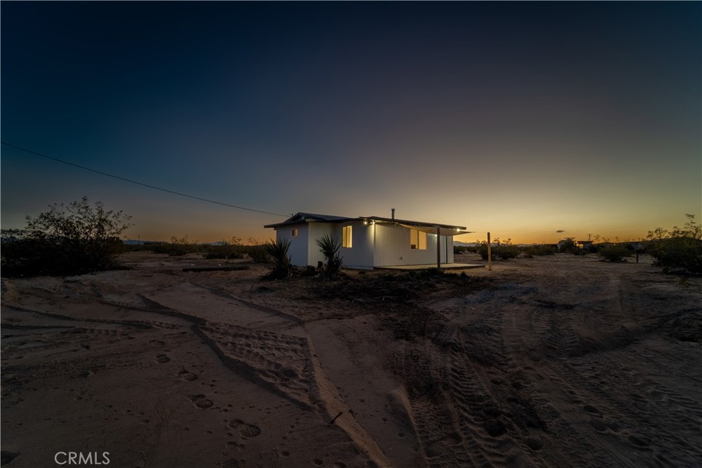 65125 Saturn Street Joshua Tree, CA 92252 - Photo 29 of 40 a view of a house with a yard