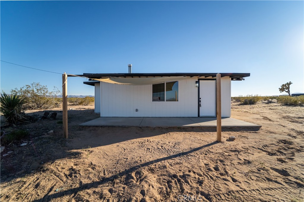 65125 Saturn Street Joshua Tree, CA 92252 - Photo 8 of 40 a house view with a backyard space