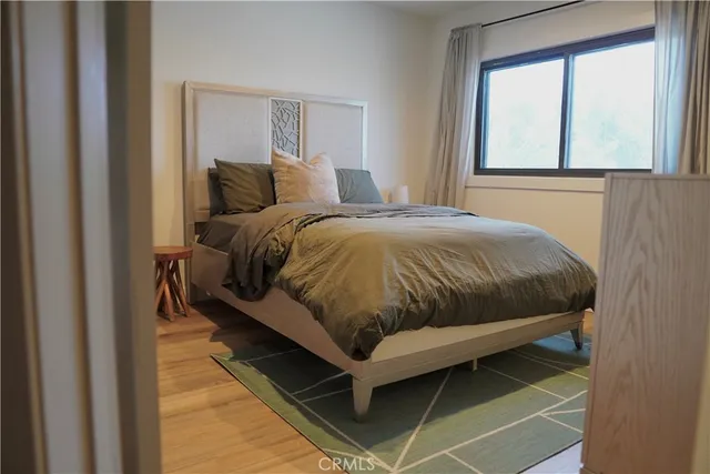 a bedroom with a bed and window