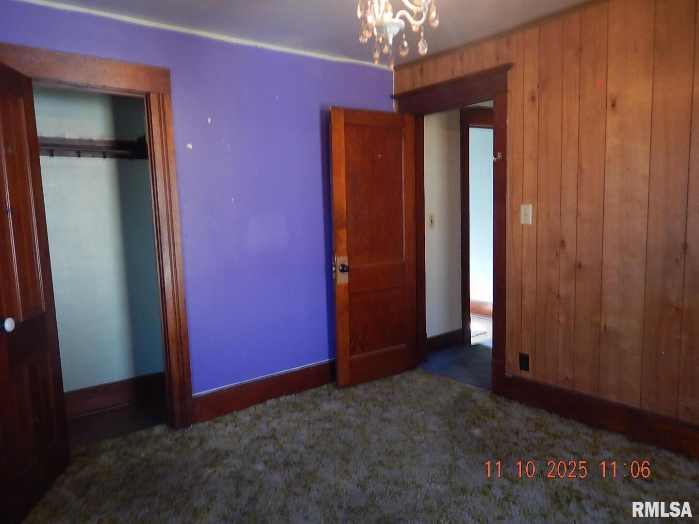 702 Elliott Street, Unit 1 Kewanee, IL 61443 - Photo 11 of 19 an empty room with windows closet and chandelier fan