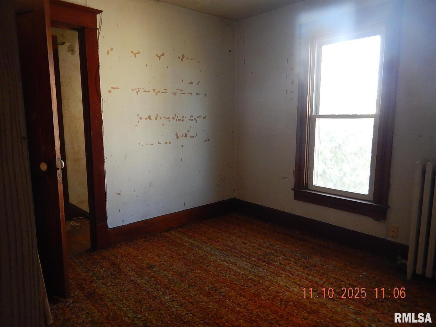 702 Elliott Street, Unit 1 Kewanee, IL 61443 - Photo 12 of 19 an empty room with a window
