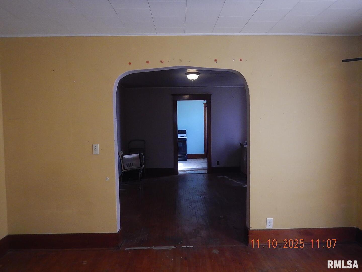 702 Elliott Street, Unit 1 Kewanee, IL 61443 - Photo 15 of 19 a view of a hallway with wooden floor