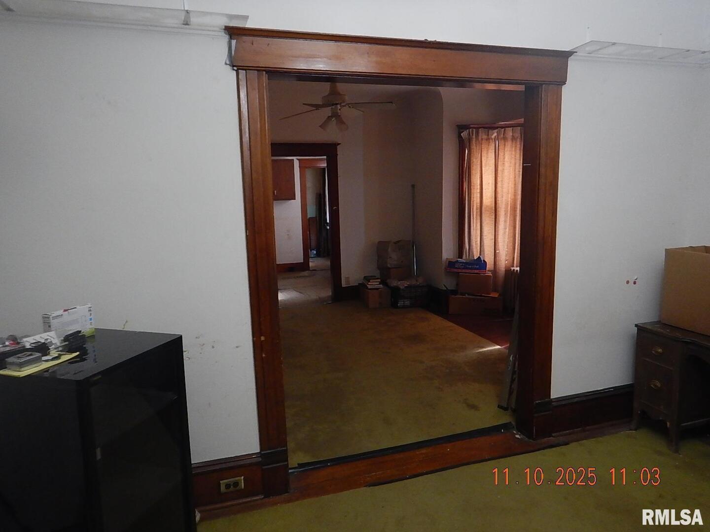 702 Elliott Street, Unit 1 Kewanee, IL 61443 - Photo 2 of 19 a view of a room that has a dresser in it
