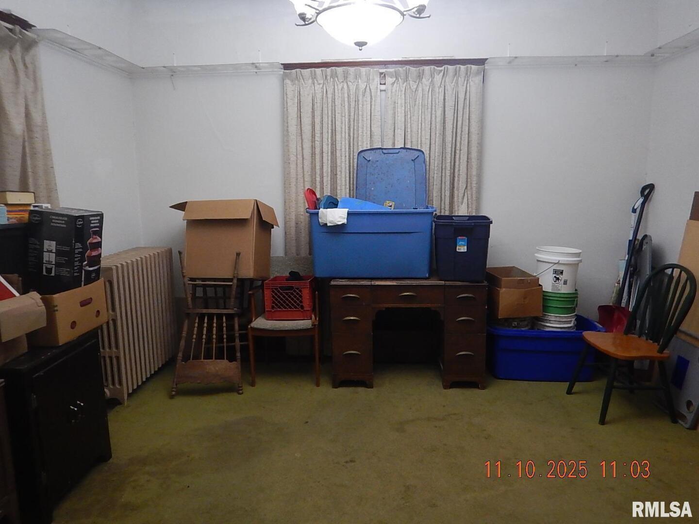 702 Elliott Street, Unit 1 Kewanee, IL 61443 - Photo 3 of 19 a room with furniture and a flat screen tv