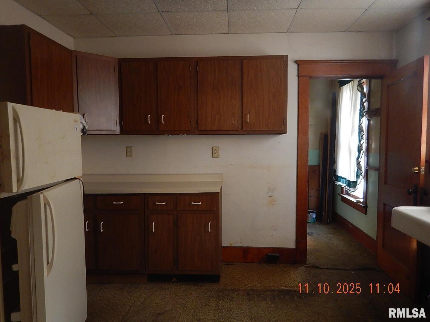 702 Elliott Street, Unit 1 Kewanee, IL 61443 - Photo 5 of 19 a kitchen with a refrigerator and a stove