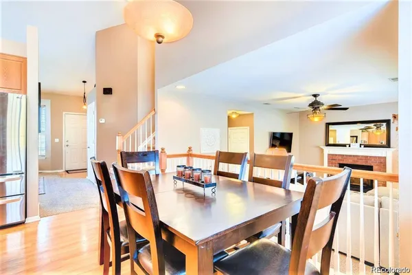 a view of a dining room with furniture and a chandelier