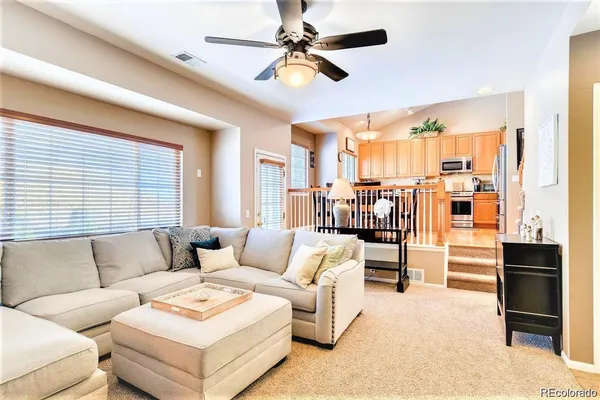 a living room with furniture and a large window