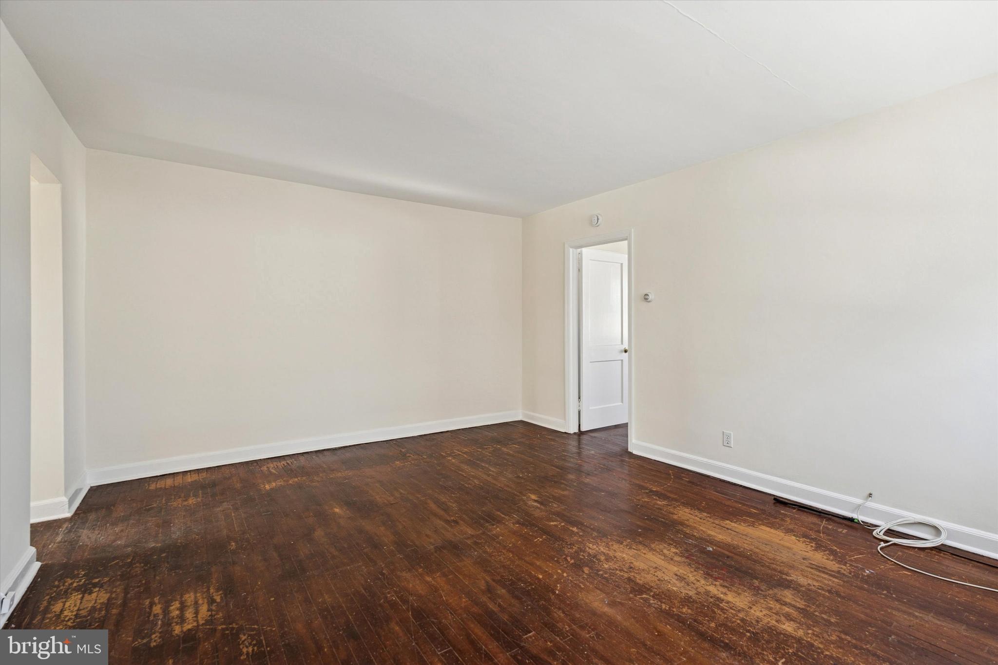 928 Fox Chase Road Jenkintown, PA 19046 - Photo 5 of 31 an empty room with wooden floor and windows