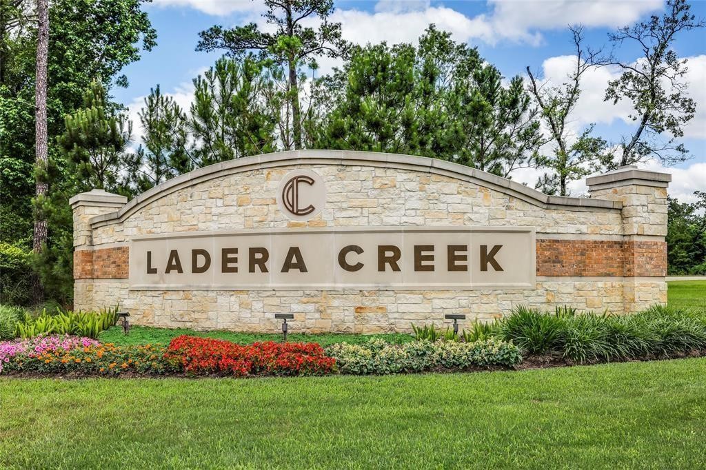 3113 Catalonion Court Conroe, TX 77301 - Photo 41 of 45 a view of outdoor space with yard and lake view