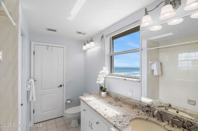 a kitchen with stainless steel appliances kitchen island granite countertop a sink and cabinets