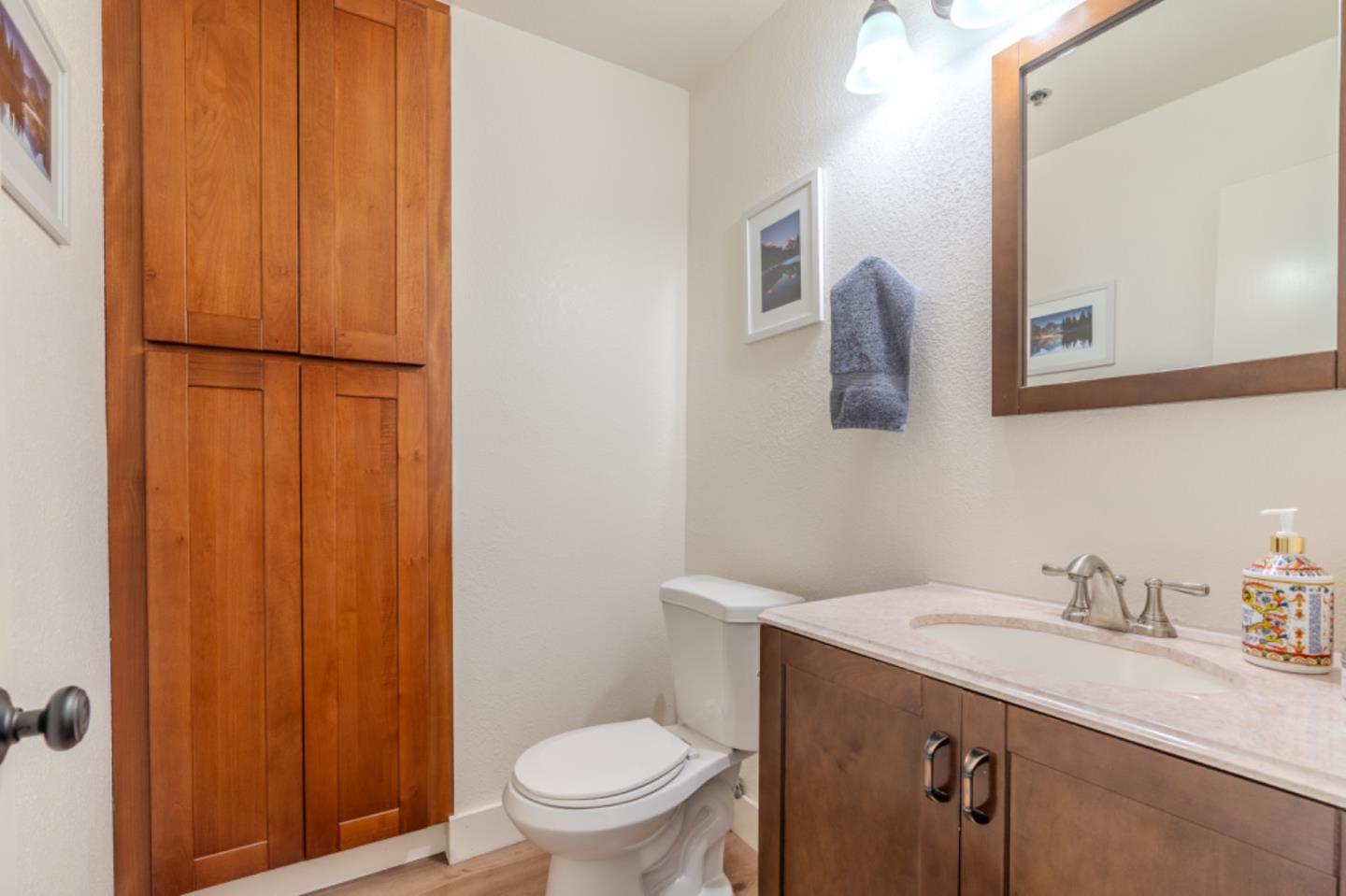 209 Clifton Road Pacifica, CA 94044 - Photo 18 of 31 a bathroom with a sink toilet and vanity