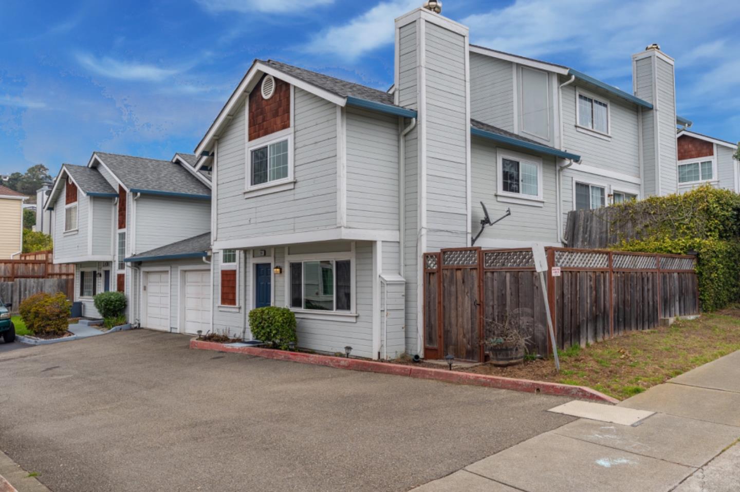 209 Clifton Road Pacifica, CA 94044 - Photo 2 of 31 a front view of a house with a garage