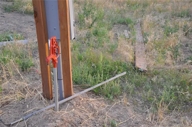 a view of a pathway with a bench in the background