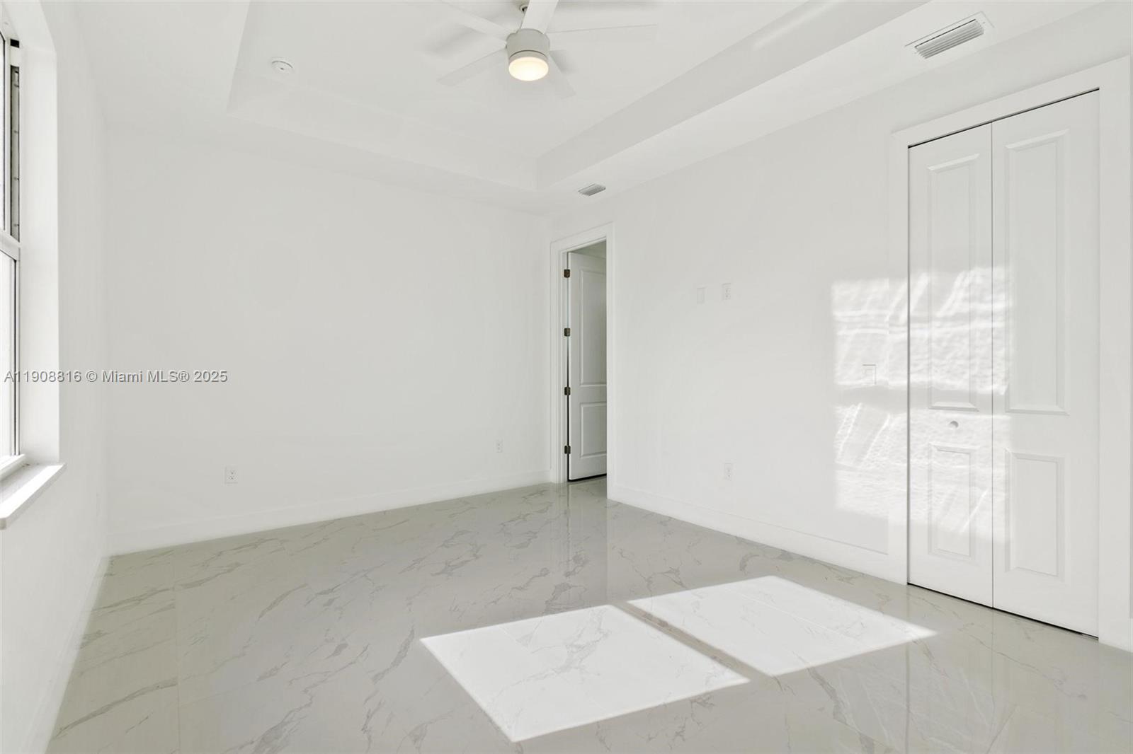2516 Park Road, Unit 2518 Lehigh Acres, FL 33971 - Photo 7 of 10 an empty room with an entryway