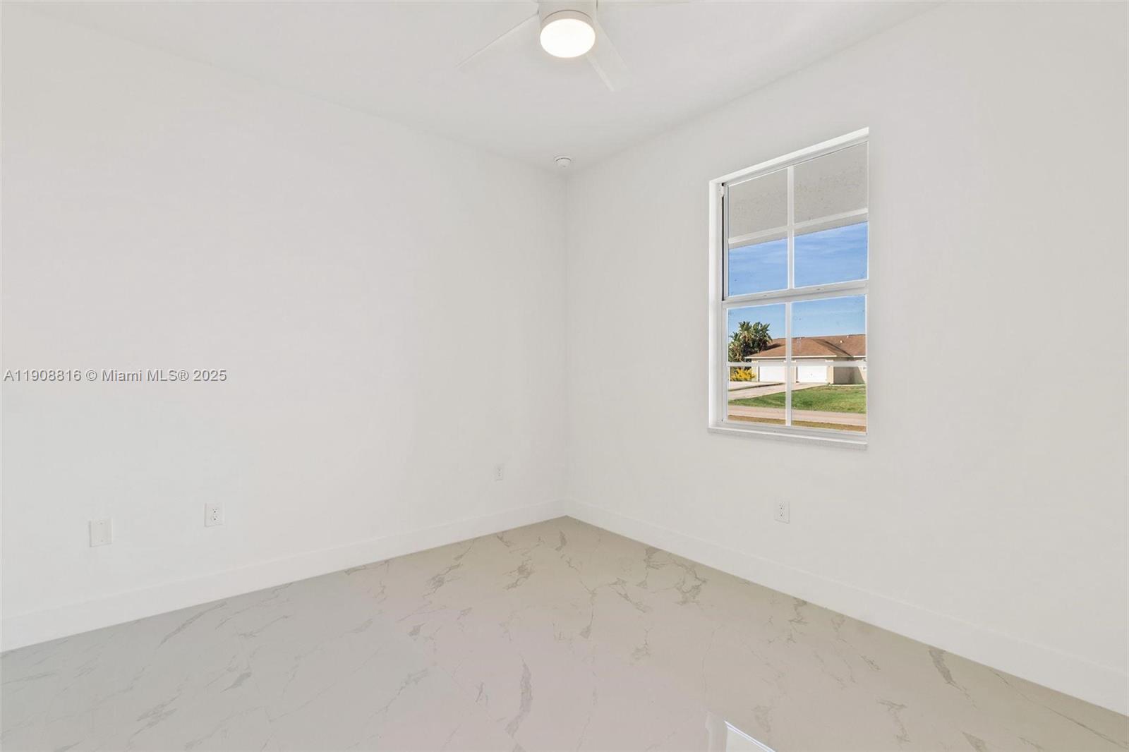2516 Park Road, Unit 2518 Lehigh Acres, FL 33971 - Photo 8 of 10 a view of a small space with a window