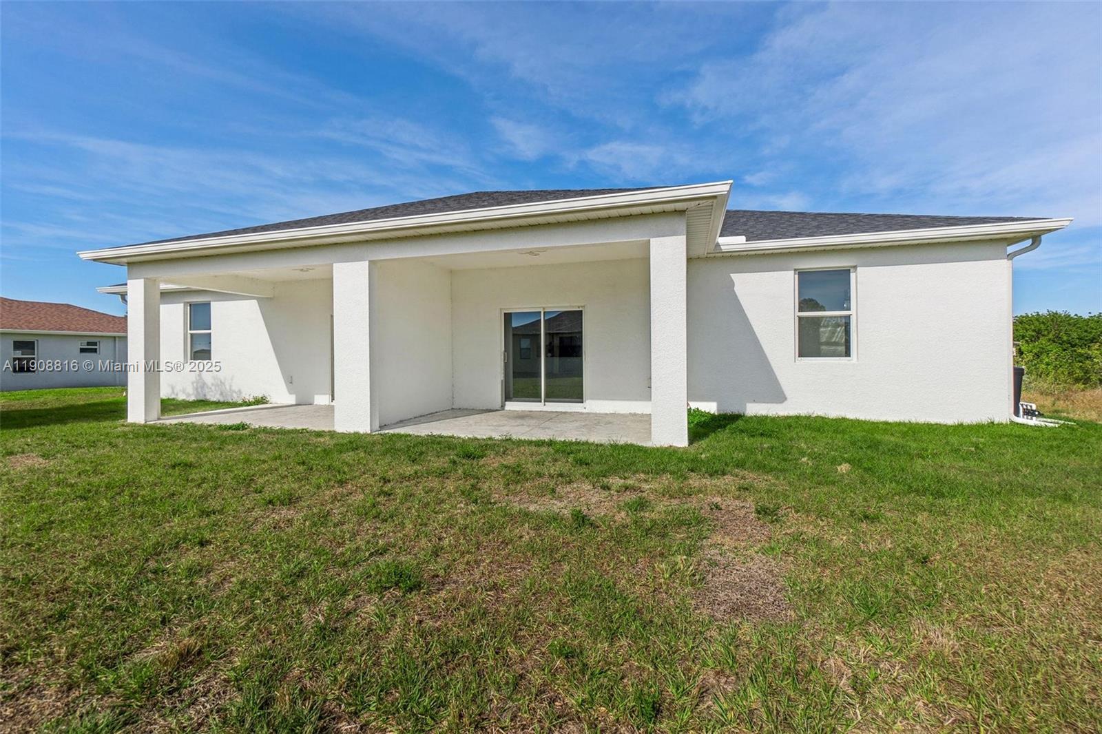 2516 Park Road, Unit 2518 Lehigh Acres, FL 33971 - Photo 10 of 10 front view of a house with a yard