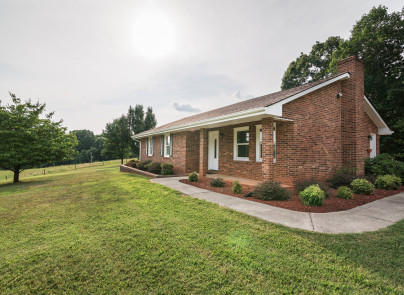445 Deep Woods Road Hardy, VA 24101 - Photo 2 of 47 a view of a house with a yard and a garden
