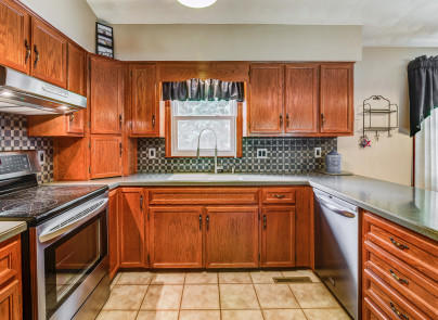 445 Deep Woods Road Hardy, VA 24101 - Photo 11 of 47 a kitchen with stainless steel appliances granite countertop a stove a sink and a microwave