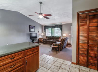445 Deep Woods Road Hardy, VA 24101 - Photo 12 of 47 a living room with furniture a window and a chandelier