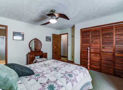 445 Deep Woods Road Hardy, VA 24101 - Photo 17 of 47 a bedroom with a bed and a chandelier
