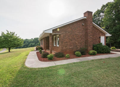 445 Deep Woods Road Hardy, VA 24101 - Photo 25 of 47 a front view of a house with garden