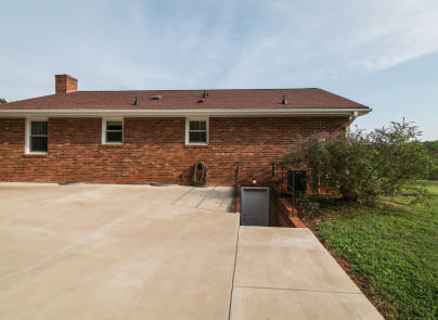 445 Deep Woods Road Hardy, VA 24101 - Photo 31 of 47 a front view of a house with a yard