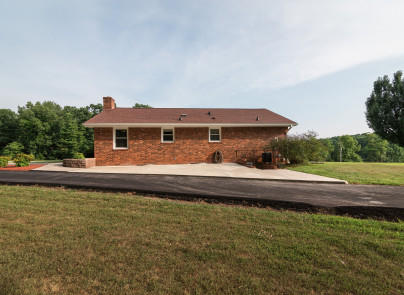 445 Deep Woods Road Hardy, VA 24101 - Photo 33 of 47 a front view of a house with a yard