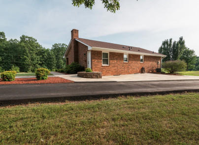 445 Deep Woods Road Hardy, VA 24101 - Photo 34 of 47 a front view of a house with a yard