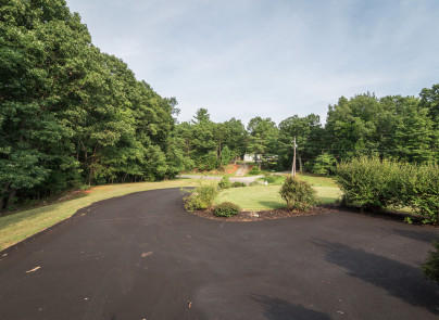 445 Deep Woods Road Hardy, VA 24101 - Photo 42 of 47 a view of a lake with a yard