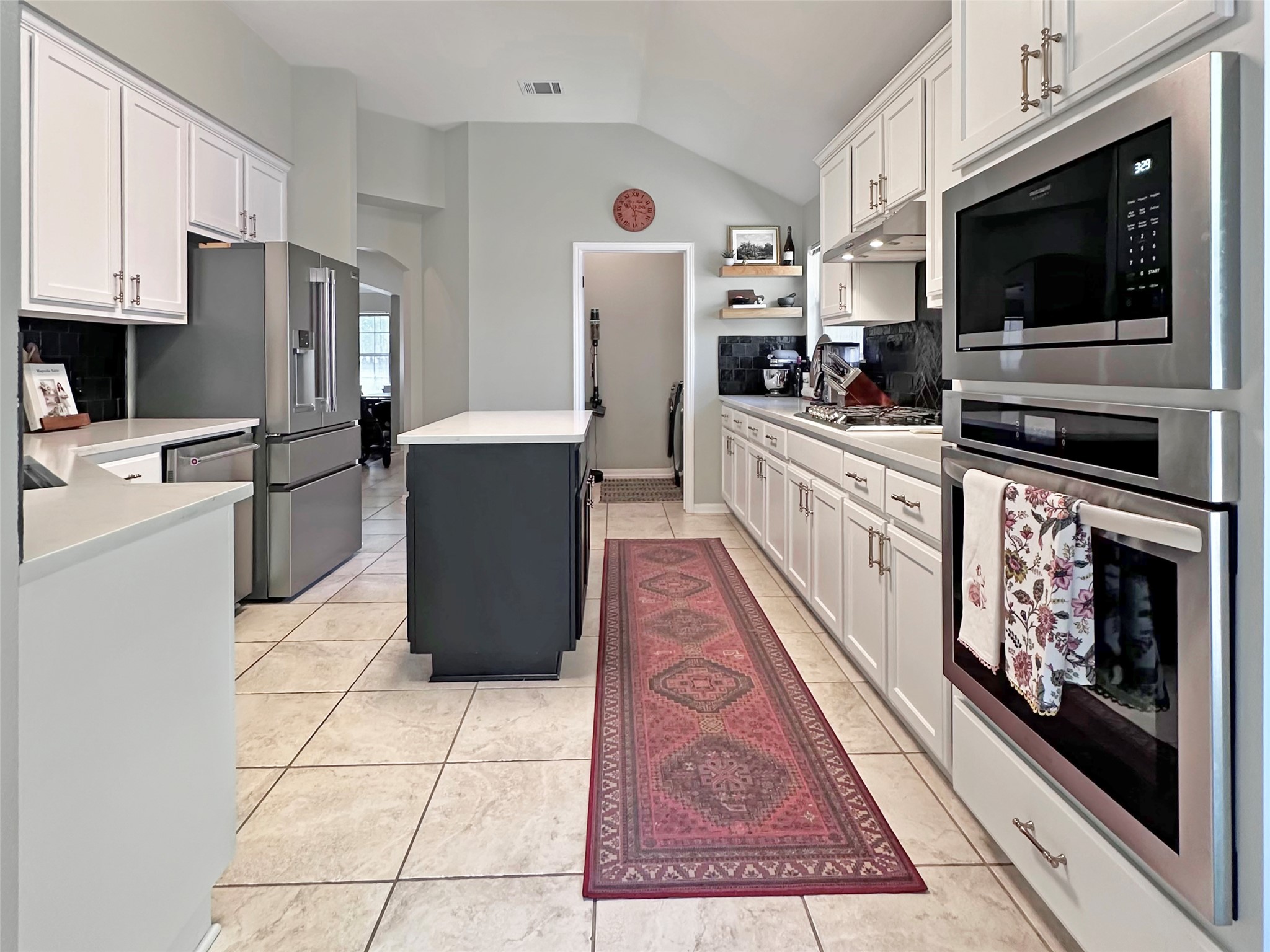 20213 Kearney Hill Road Pflugerville, TX 78660 - Photo 11 of 27 Culinary delights await in this modern kitchen with extensive counter space and quality appliances.