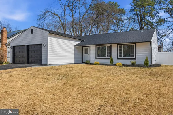 a house with trees in front of it