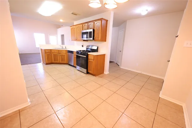 a view of a hallway with stairs