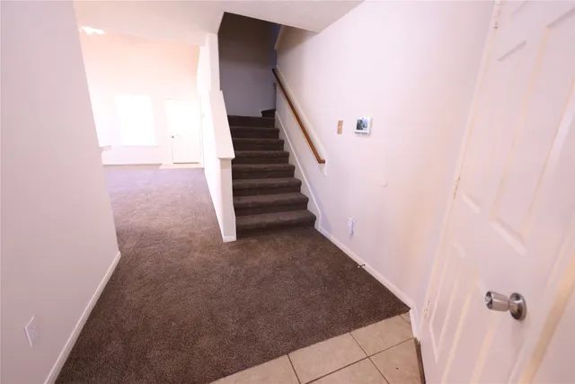 a view of a hallway with staircase