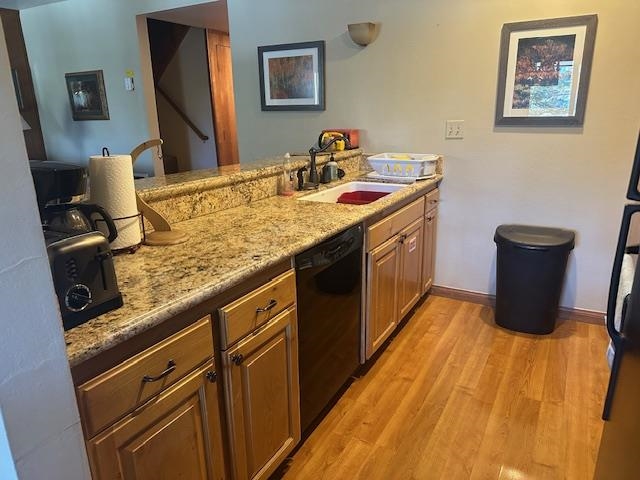 25 Lee Road, Unit 106 Mammoth Lakes, CA 93546 - Photo 2 of 6 a kitchen with a sink and wooden cabinets