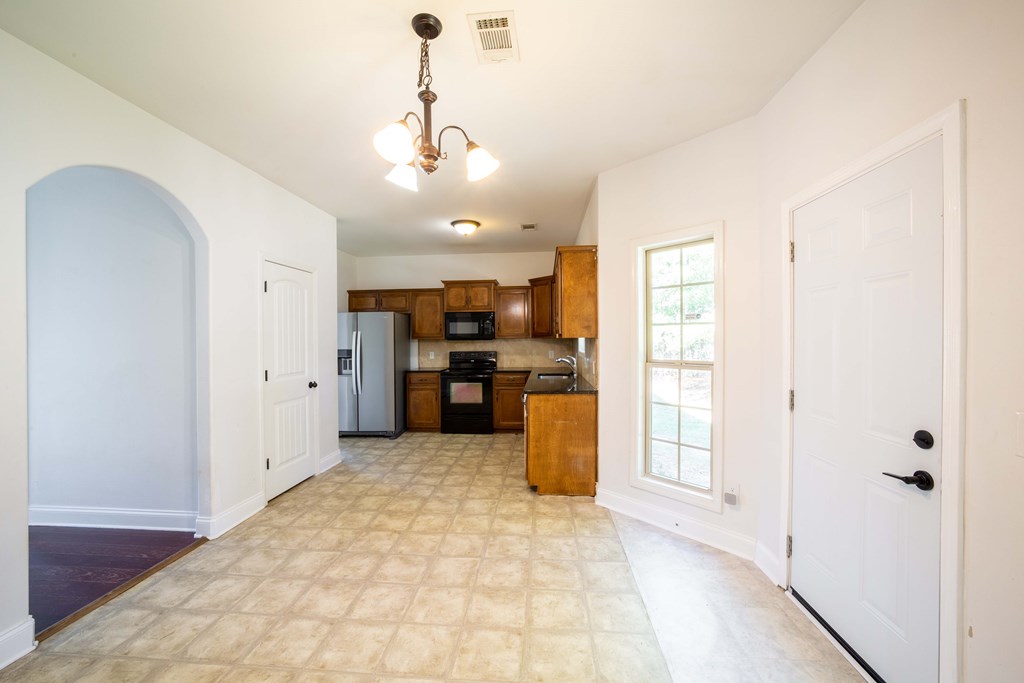 5151 Mccaghren Drive Columbus, GA 31909 - Photo 6 of 15 a view of a kitchen with a sink and refrigerator