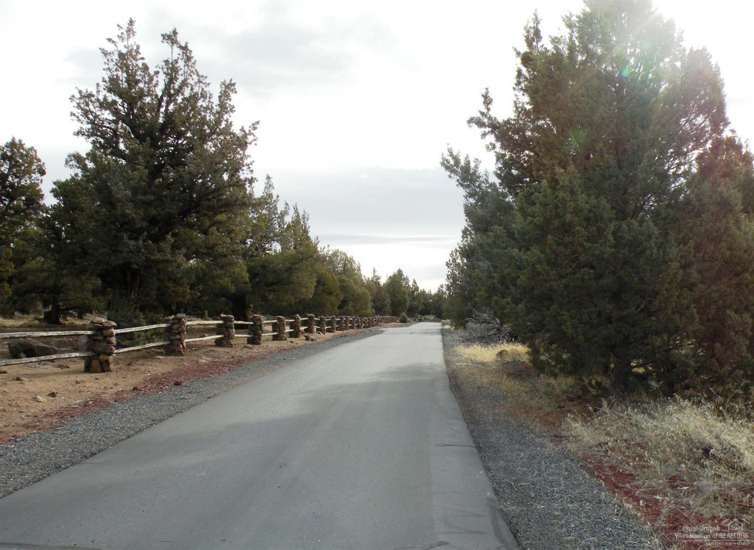 65145 Smokey Ridge Road Bend, OR 97703 - Photo 13 of 13 a view of a road with trees on the side of the road